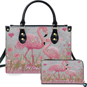 Front view of pink flamingo handbag and matching wallet set with sparkling crystal accents.