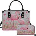 Front view of pink flamingo handbag and matching wallet set with sparkling crystal accents.