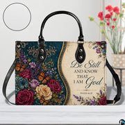 Top angle view displaying open interior layout and structured silhouette of teal baroque handbag.
