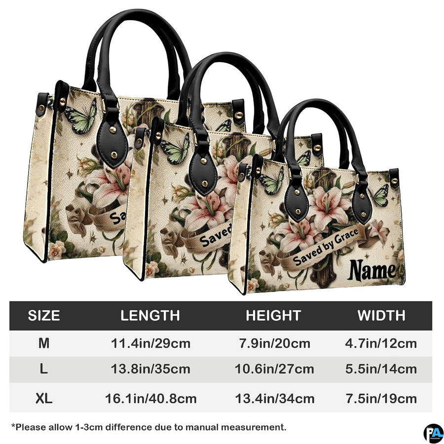 Angled perspective view of lily cross handbag highlighting floral depth and cross details.