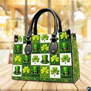 Angled green clover and top hat checkerboard handbag on a tabletop