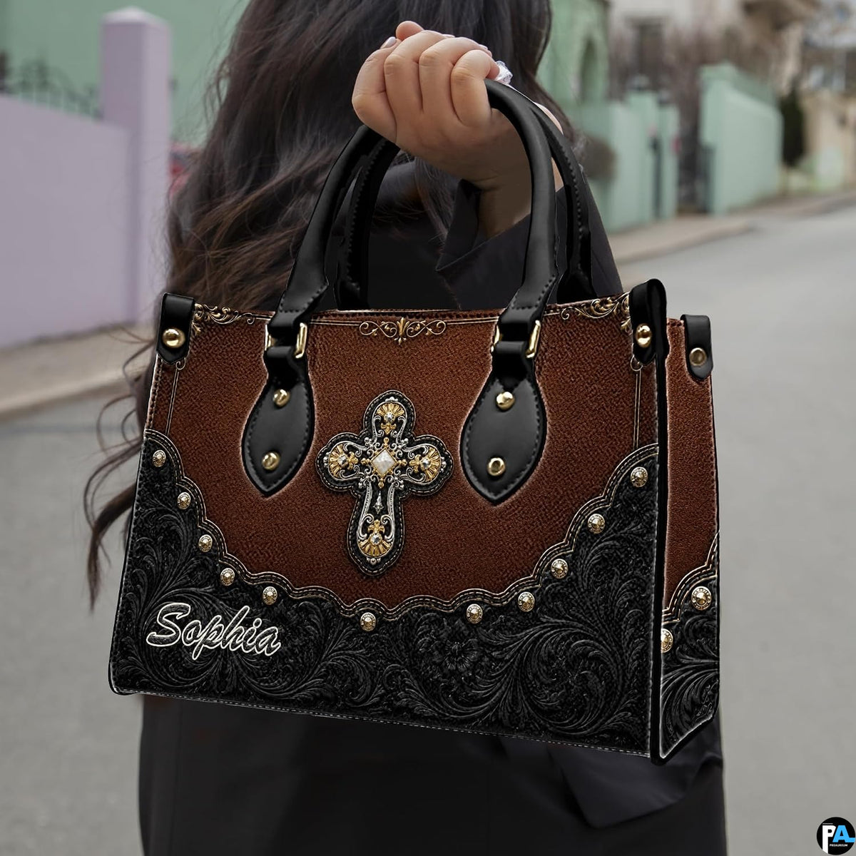 Side profile showing structured silhouette and wrap-around floral corner tooling of handbag.
