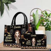 Christian nurse handbag and matching wallet set displayed on tabletop beside greenery.