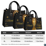Coordinated set showcase of sacred golden halo handbag and companion wallet on plain backdrop.