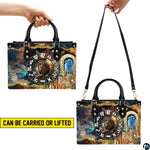 Demonstration illustrating hand carry and shoulder strap carry for Celestial Lion Satchel Handbag.