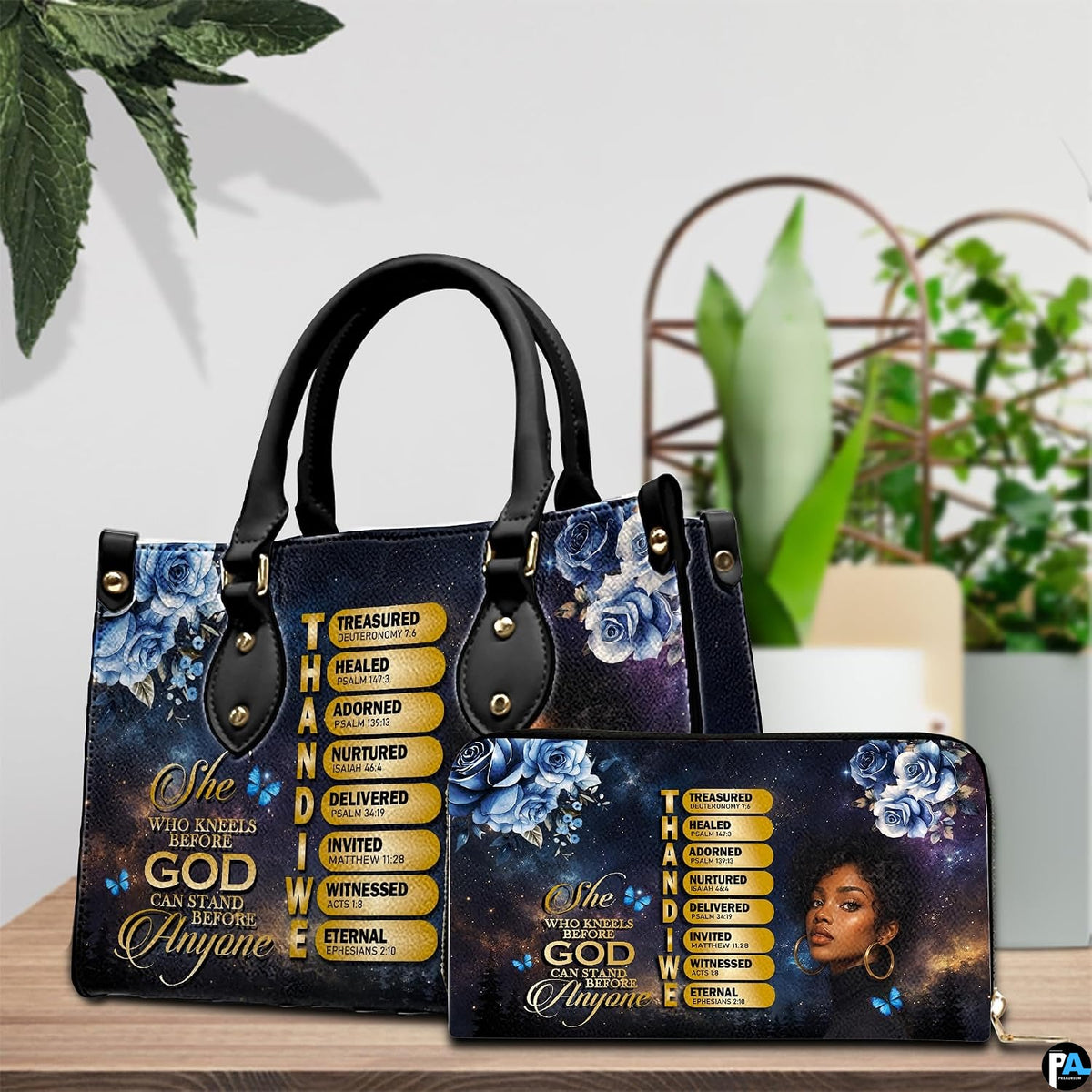 Tabletop presentation highlighting Christian scripture artwork resting beside leafy indoor greenery.