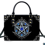 Gothic Wiccan silver pentagram sapphire handbag shown alone on white background.