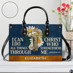 Front view of navy cross handbag on white tabletop with circular textured exterior swatch.