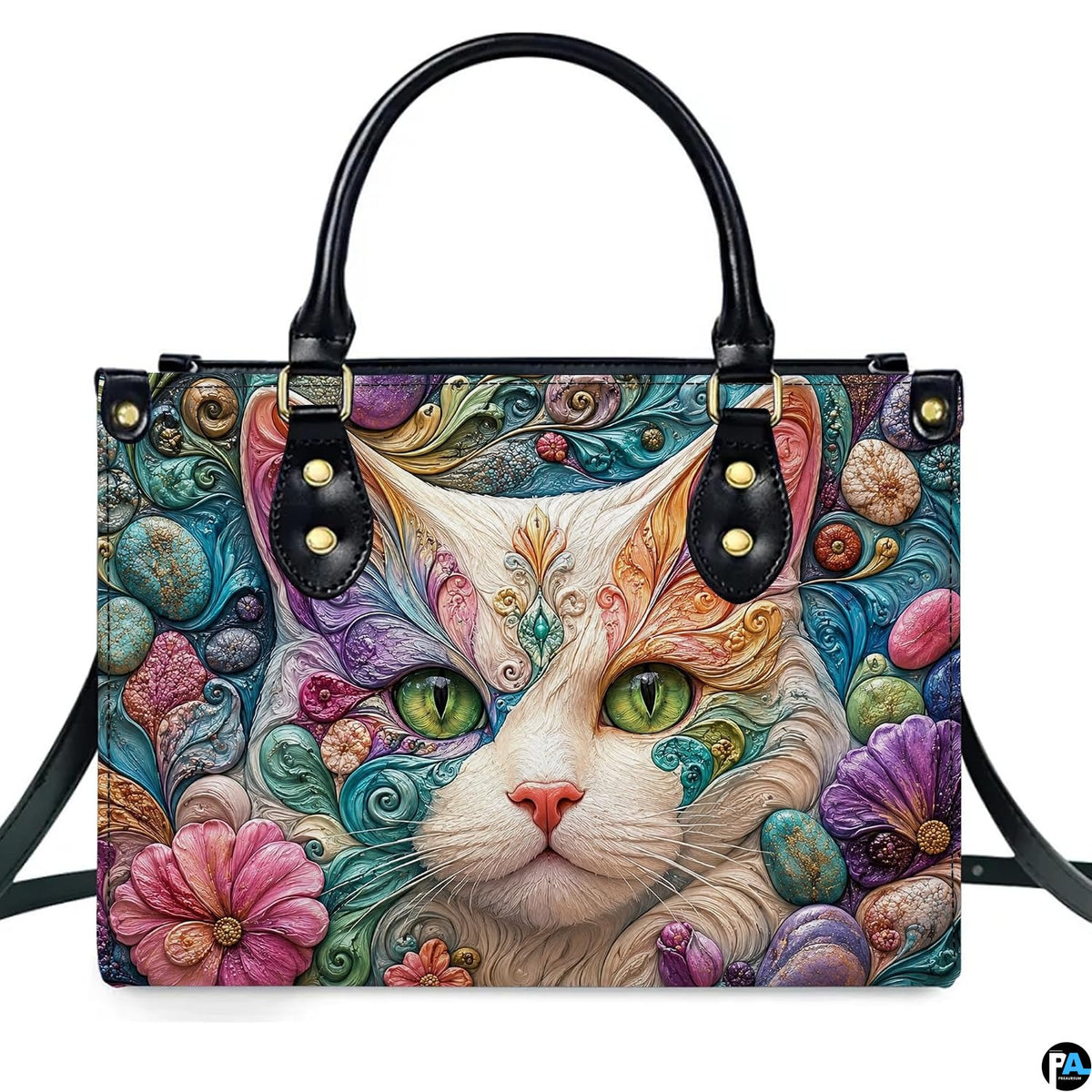 Front studio shot of white cat emerald eyes and sculpted filigree, flowers, and pebbles.