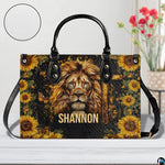 Front view of lion sunflower cross handbag showing noble lion portrait, wooden cross, and blooms.