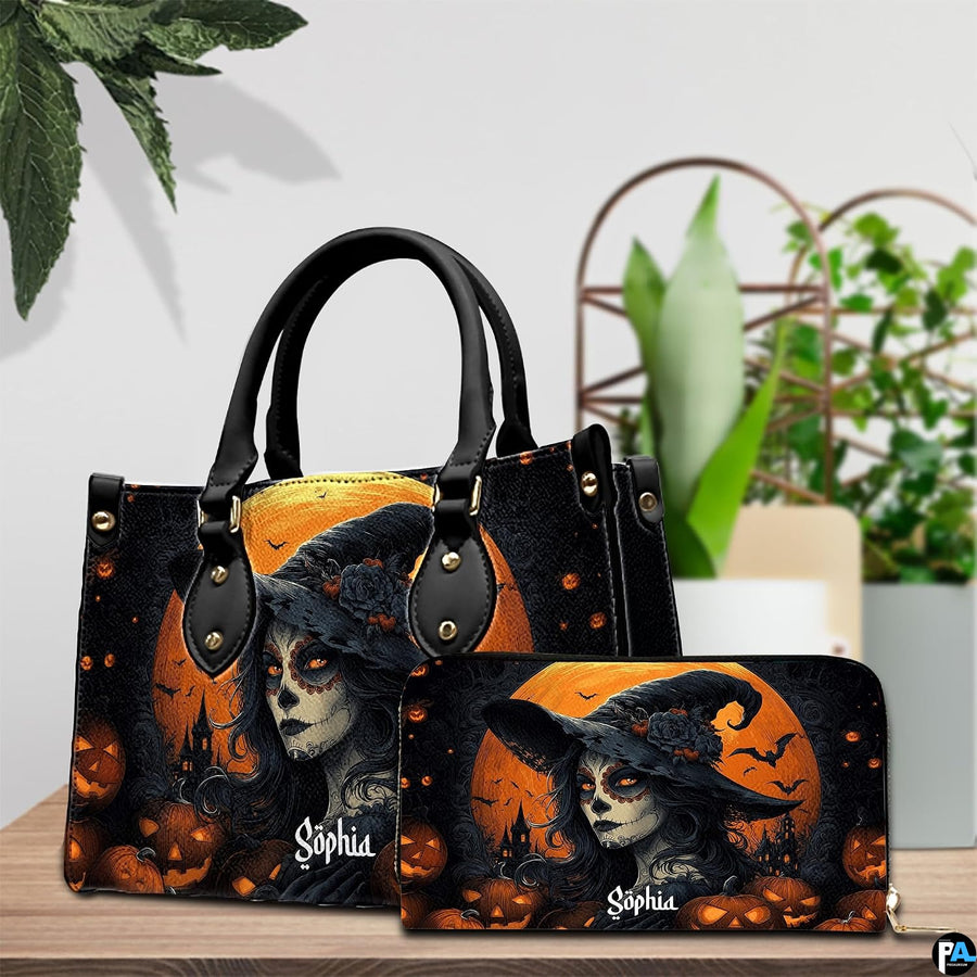 Sugar skull witch handbag on white table beside floral bouquet with texture swatch inset.
