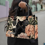 Outdoor pedestrian holding an accessory showcasing botanical cat art during a daytime stroll.