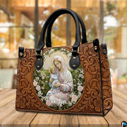 Interior view of tooled Madonna handbag showing interior lining and compartment layout