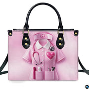Front view of pink nurse medical handbag featuring scrub uniform graphic, stethoscope, and cross insignia