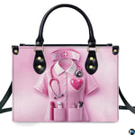 Front view of pink nurse medical handbag featuring scrub uniform graphic, stethoscope, and cross insignia