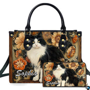 Black white cat art display presenting fluffy tuxedo feline portrait framed by amber floral wood carvings.