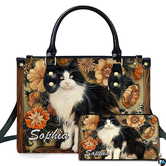 Black white cat art display presenting fluffy tuxedo feline portrait framed by amber floral wood carvings.