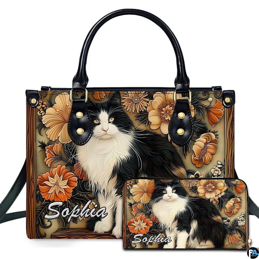 Black white cat art display presenting fluffy tuxedo feline portrait framed by amber floral wood carvings.