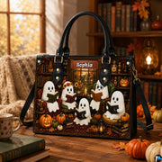 Indoor desk perspective showing ghost library satchel positioned near pumpkins and autumn window.