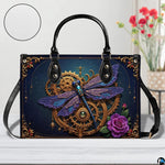 Lifestyle setting of steampunk clockwork dragonfly handbag and wallet set