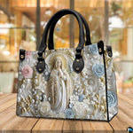 Side profile view of structured pearl Madonna handbag showing silhouette and contrast black handles