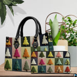 Tabletop presentation showing geometric pine tree grid artwork beside indoor houseplant.