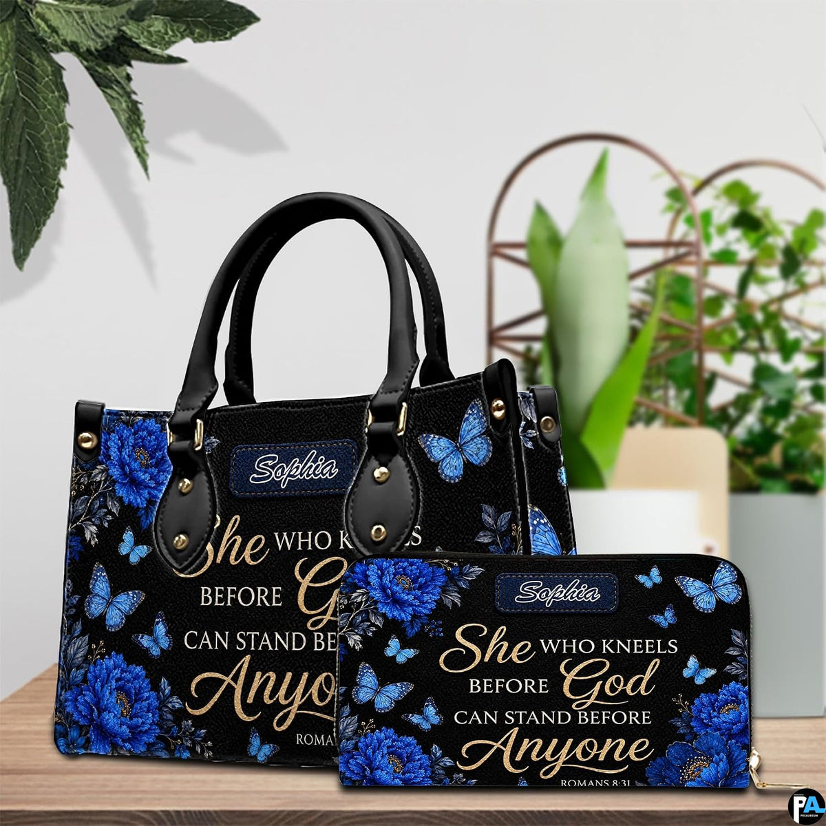 Side view of royal blue floral handbag showing structured silhouette and seamless edge construction.