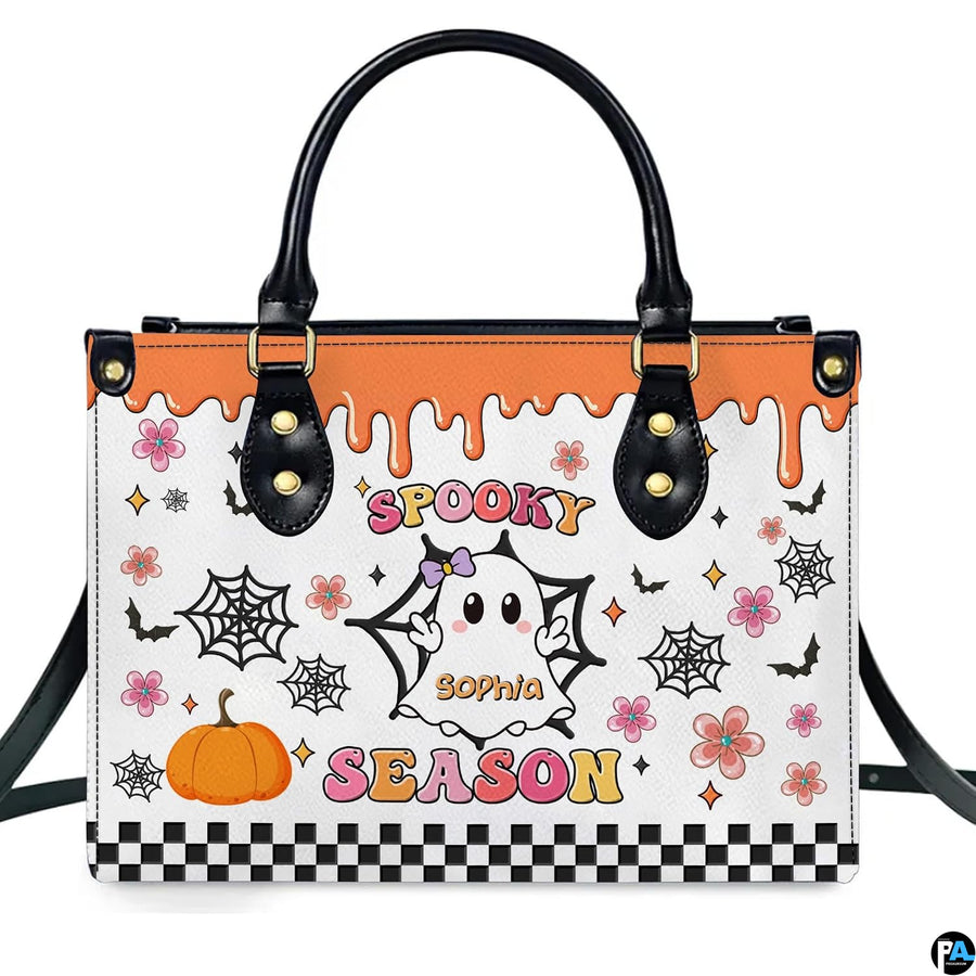 Studio portrait presenting cute ghost and harvest pumpkin artwork centered against plain white backdrop.