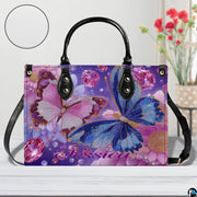Perspective angle of the twin butterfly handbag highlighting print clarity and contours.