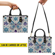 Matching butterfly wallet lying flat displaying the coordinating frozen crystal butterfly motif.