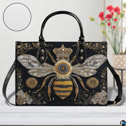 Matching bee wallet lying flat displaying the coordinating crowned queen bee artwork.