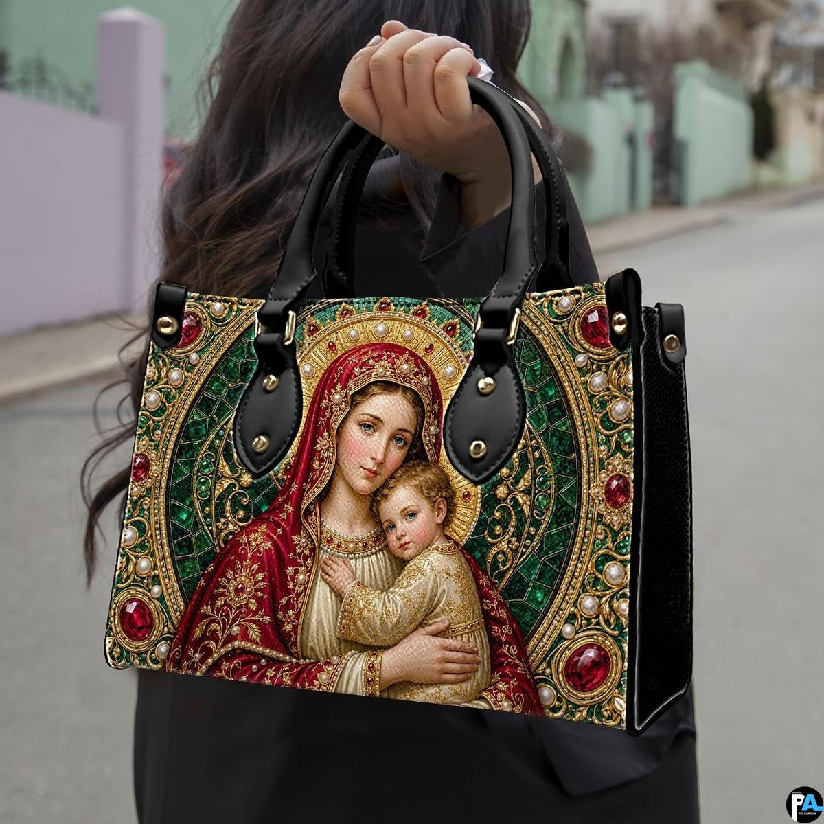 Side profile view of structured Madonna handbag showing silhouette and black carry handles