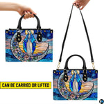 Infographic showing top handle carrying and shoulder strap wear options for the handbag.