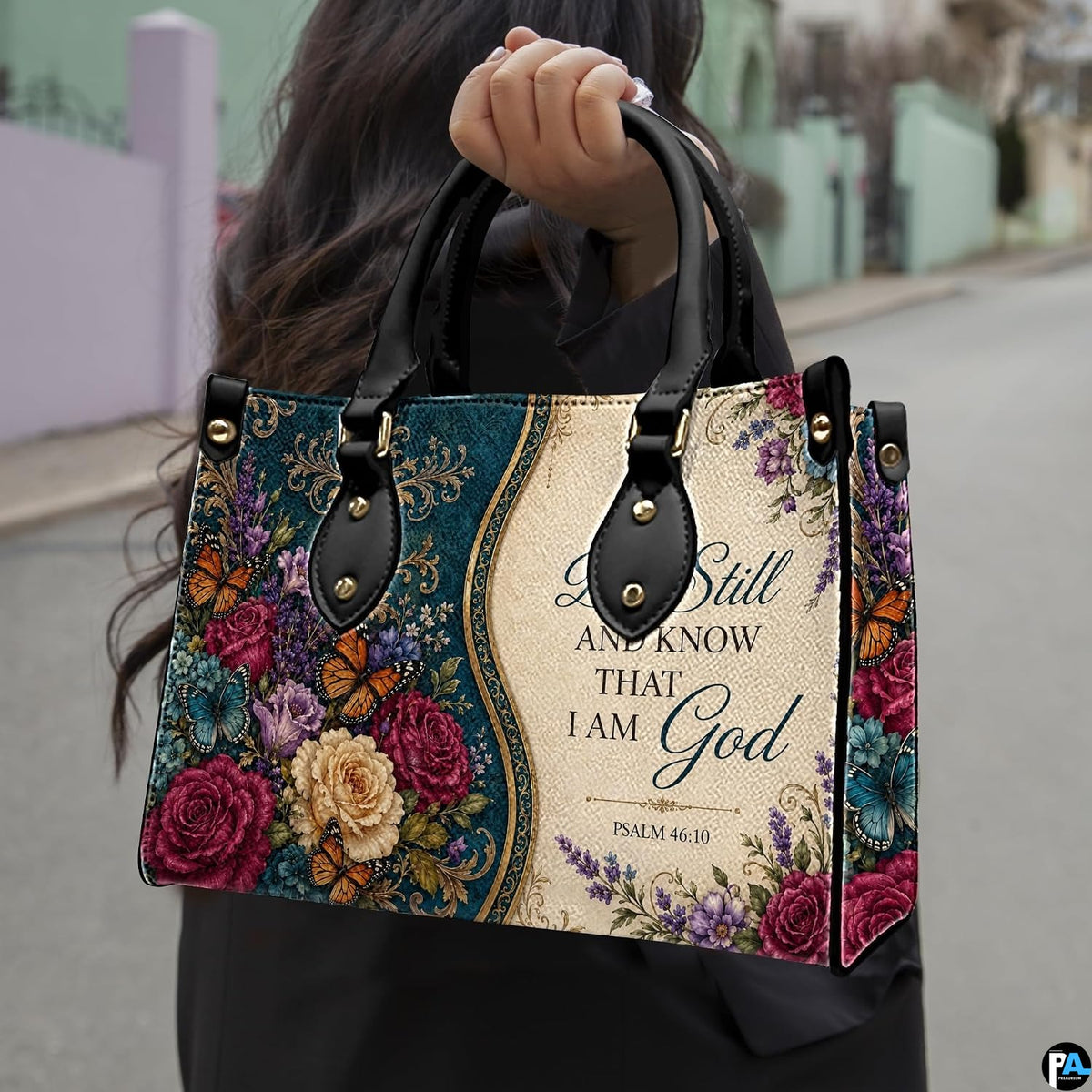 Side view of teal baroque floral handbag showing rich jewel-toned damask and botanical blossom print.