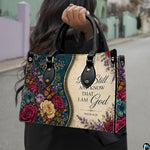 Side view of teal baroque floral handbag showing rich jewel-toned damask and botanical blossom print.