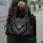Outdoor presentation showing crowned cat artwork held while walking along an urban walkway.