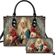 Front view of Virgin Mary rose handbag and matching zippered wallet with blooming floral frame.