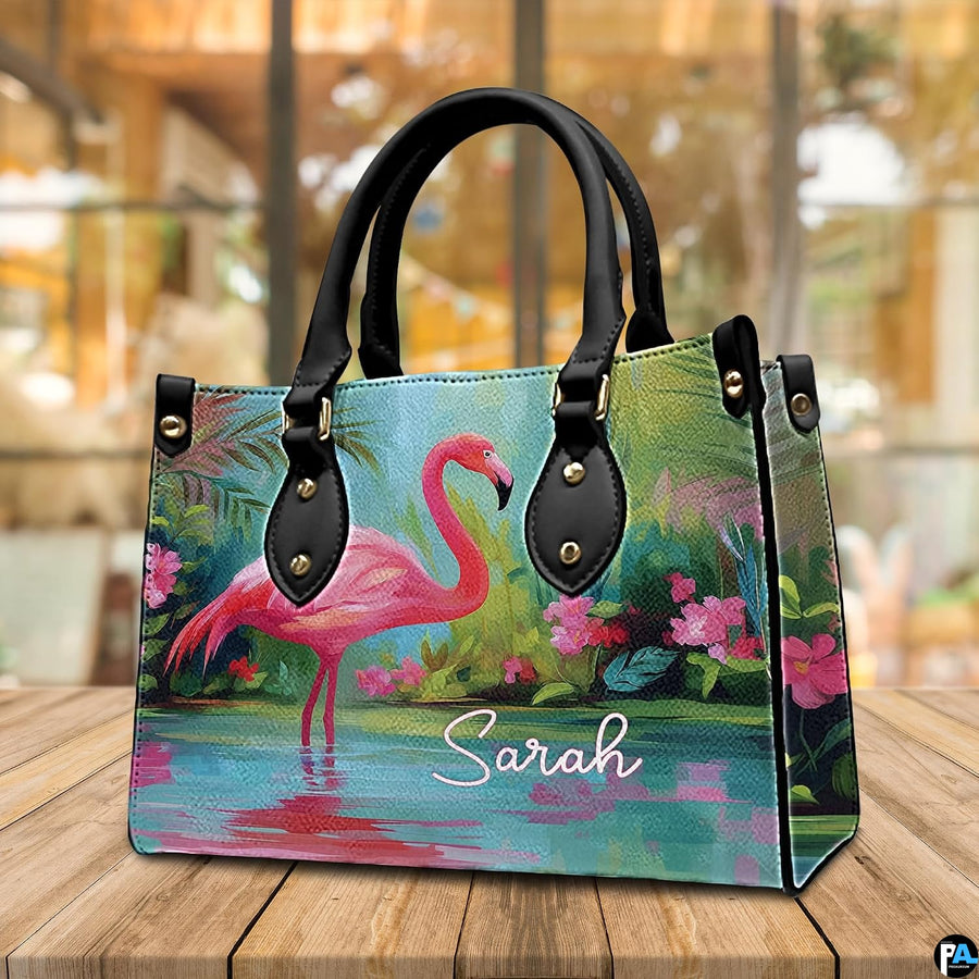 Side profile perspective of the handbag showing structured side panel and hardware.
