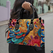 Woman carrying a colorful blue and gold peacock handbag