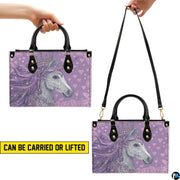 Top-down view of the handbag displaying the spacious interior compartment and handles.
