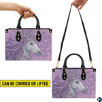 Top-down view of the handbag displaying the spacious interior compartment and handles.