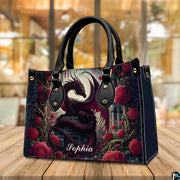 Crimson dragon handbag on wooden cafe table with warm background lighting.