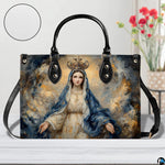 Queen of Heaven Marian handbag displayed on wooden tabletop with texture swatch and flowers