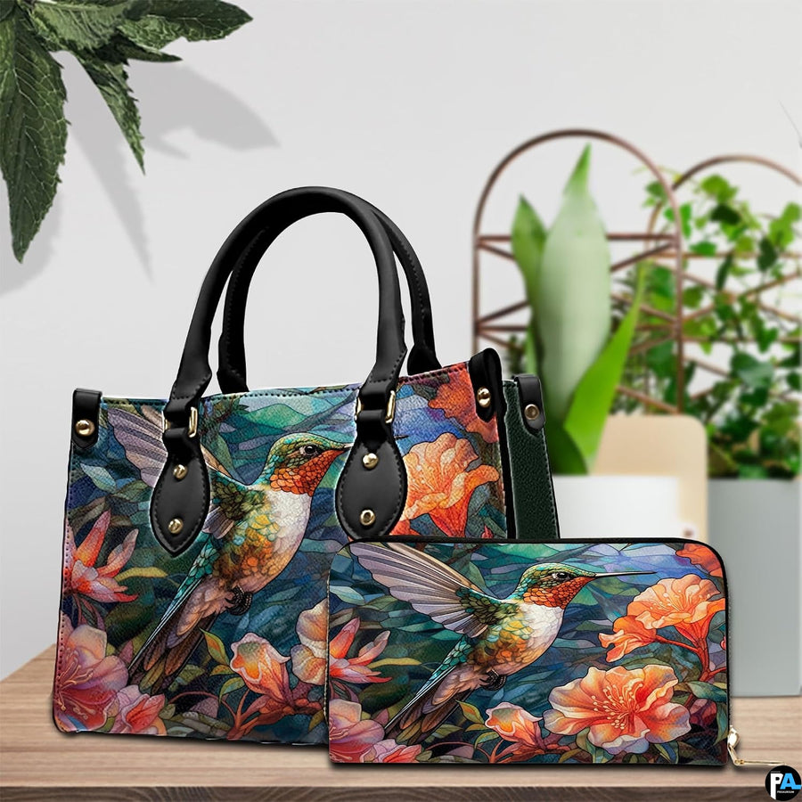 Handbag and matching wallet set displayed together on wooden table beside a green houseplant.