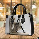 Angled book page dress handbag with afro silhouette and heels