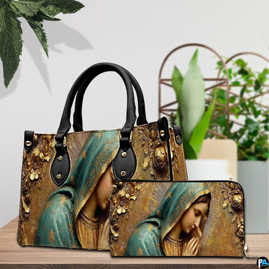 Angled perspective showing golden sculpted Mary bas-relief design on structured handbag