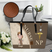 Studio display of Mocha Clinician Tote Handbag resting on a sofa with inset detailing surface grain.