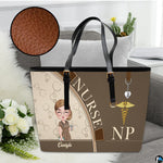 Studio display of Mocha Clinician Tote Handbag resting on a sofa with inset detailing surface grain.