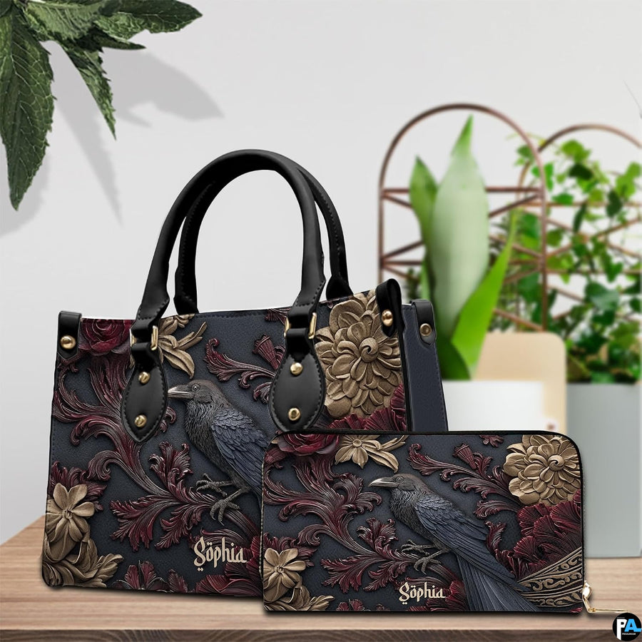 Gothic raven handbag displayed on wooden tabletop in front of sunlit windows.