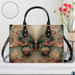 Home lifestyle view of Rococo butterfly handbag on white table beside decorative flowers